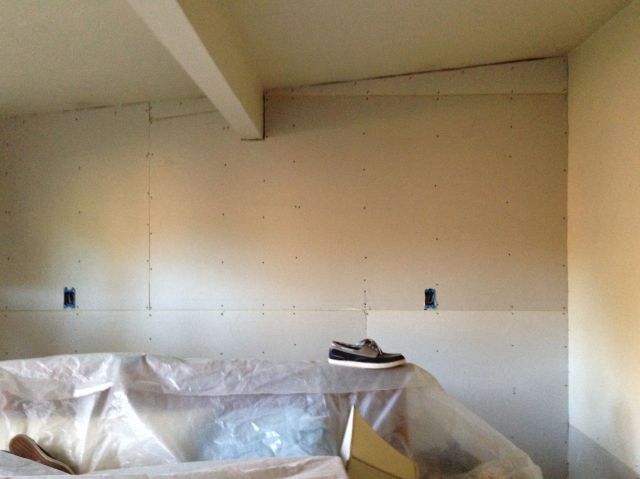 The bedroom wall. The shoe was an artistic addition to the photo.