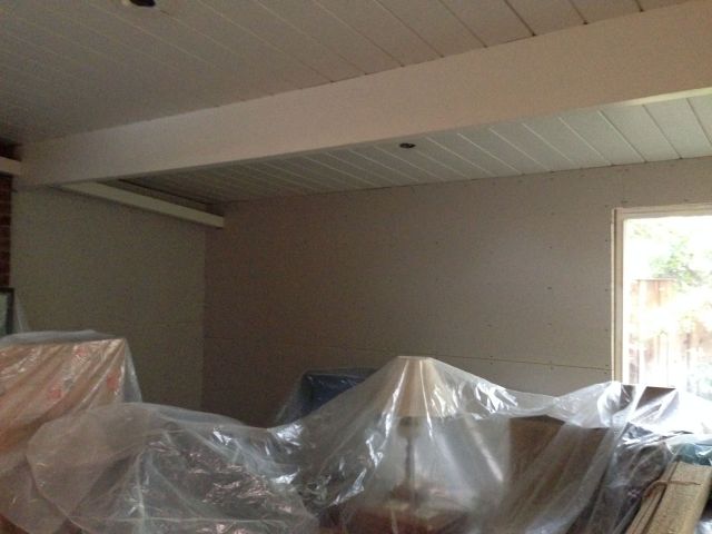 The living room wall. I am thinking of just keeping the plastic covers.