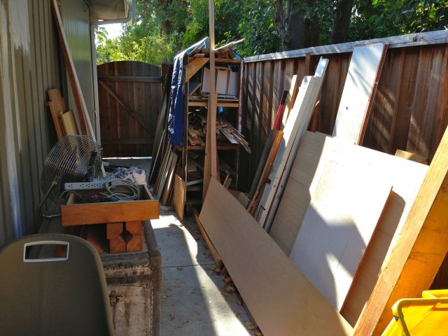 The wood that survived kitty poop and fuel oil is now outside waiting for the new lumber rack.