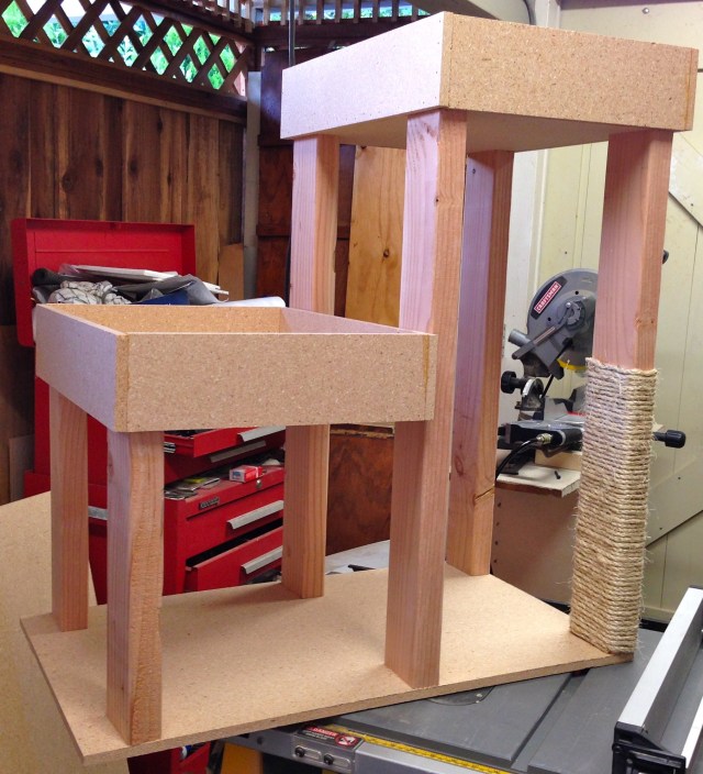 The lower box is 12 inches high and the upper box at 28.  Just the right size for a senior kitty.