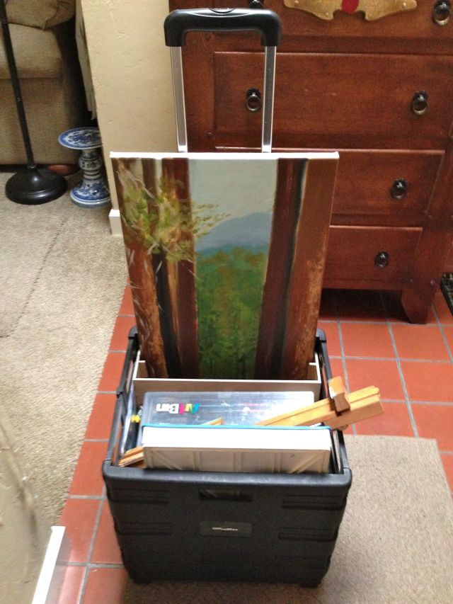 Here's the little pull cart with all her supplies and a painting she's working on.