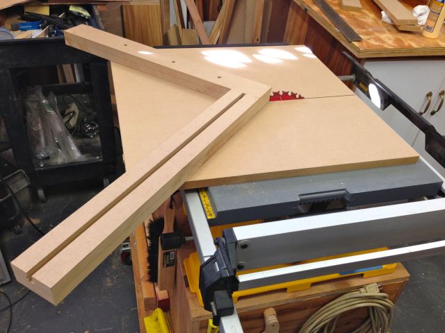The miter sled fits on the table saw to cut the 45 degree angle.  This isn't fully complete as it still needs a few more parts.