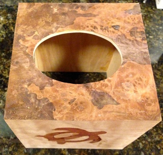 The top is just plain.  The wood is a walnut burl.